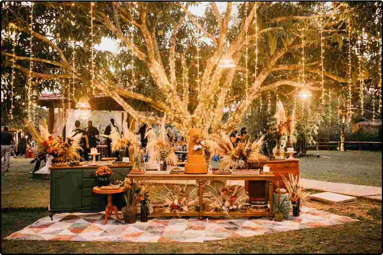 Wedding reception venue decorated in a rustic theme with wooden accents and fairy lights.